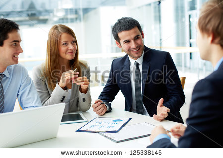 stock-photo-image-of-business-partners-discussing-documents-and-ideas-at-meeting-125338145 stock-photo-image-of-business-partners-discussing-documents-and-ideas-at-meeting-125338145