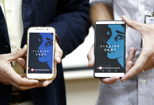 Representative of the United Nations High Commissioner for Refugees (UNHCR) Malaysia Richard Towle, left, and Executive Creative Director of GREY Malaysia, Graham Drew, right, shows the application "Finding Home" on their phones during a launch at the UNHCR headquarters in Kuala Lumpur, Malaysia, Tuesday, April 25, 2017. The refugee agency and the Malaysian firm have launched the application aimed at raising public awareness and empathy about the worldwide struggle of refugees. (AP Photo/Daniel Chan) Representative of the United Nations High Commissioner for Refugees (UNHCR) Malaysia Richard Towle, left, and Executive Creative Director of GREY Malaysia, Graham Drew, right, shows the application "Finding Home" on their phones during a launch at the UNHCR headquarters in Kuala Lumpur, Malaysia, Tuesday, April 25, 2017. The refugee agency and the Malaysian firm have launched the application aimed at raising public awareness and empathy about the worldwide struggle of refugees. (AP Photo/Daniel Chan)