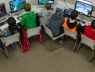 Sixth-graders at Dzantik'i Heeni Middle School work on the Mindcraft mazes during their technology class in Juneau, Alaska, on Friday, March 6, 2015.  Rather than fight the electronic glue, some educators are embracing children tech-obsession and finding ways to incorporate computer games into the classroom. None has been more popular than Minecraft. (AP Photo/The Juneau Empire, Michael Penn )
