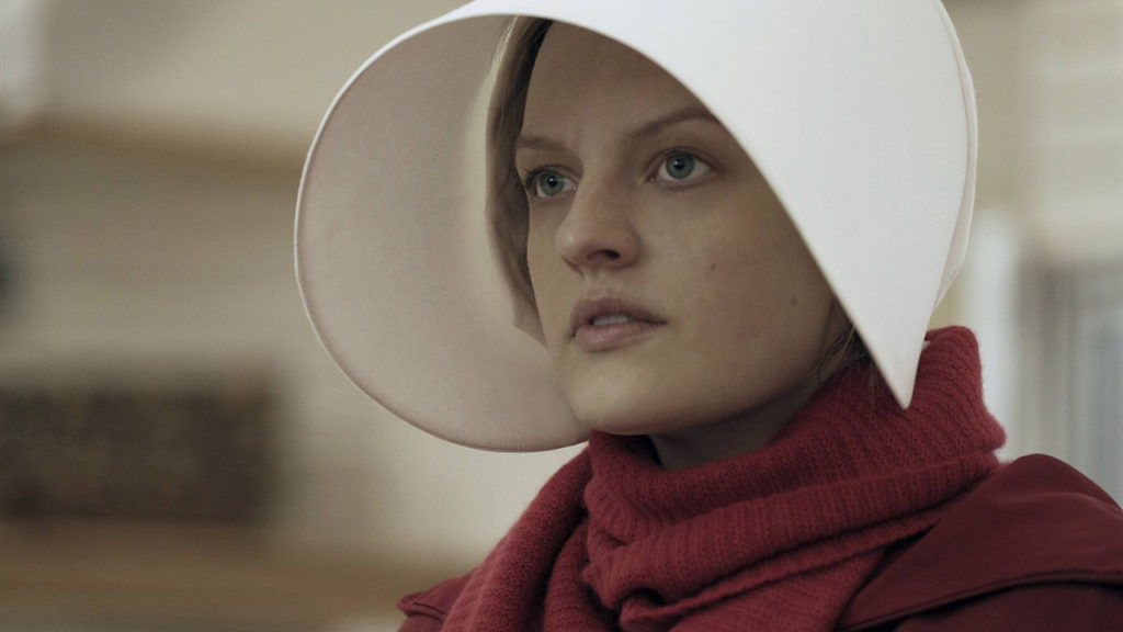 This image released by Hulu shows Elisabeth Moss as Offred in a scene from, "The Handmaid's Tale." Moss is nominated for an Emmy Award for outstanding lead actress in a drama series . The Emmy Awards ceremony, will air on Sept. 17. (George Kraychyk/Hulu via AP) This image released by Hulu shows Elisabeth Moss as Offred in a scene from, "The Handmaid's Tale." Moss is nominated for an Emmy Award for outstanding lead actress in a drama series . The Emmy Awards ceremony, will air on Sept. 17. (George Kraychyk/Hulu via AP)