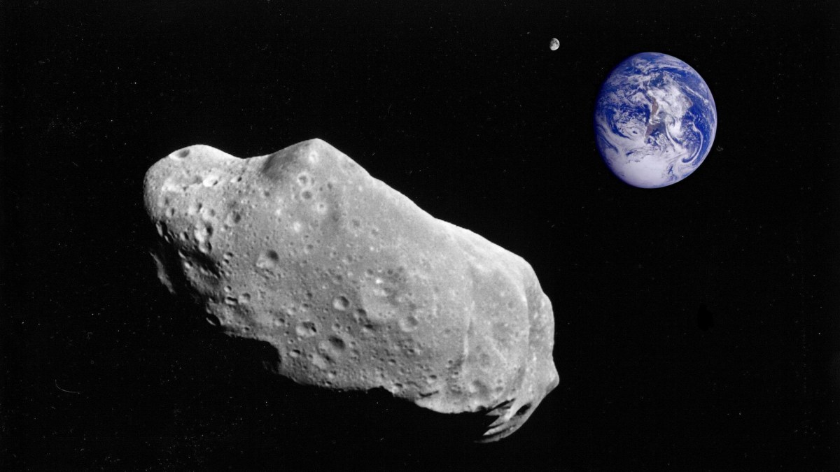 Un astéroïde et la Terre en arrière plan. // Source : Pixabay (photo recadrée) Un astéroïde et la Terre en arrière plan. // Source : Pixabay (photo recadrée)