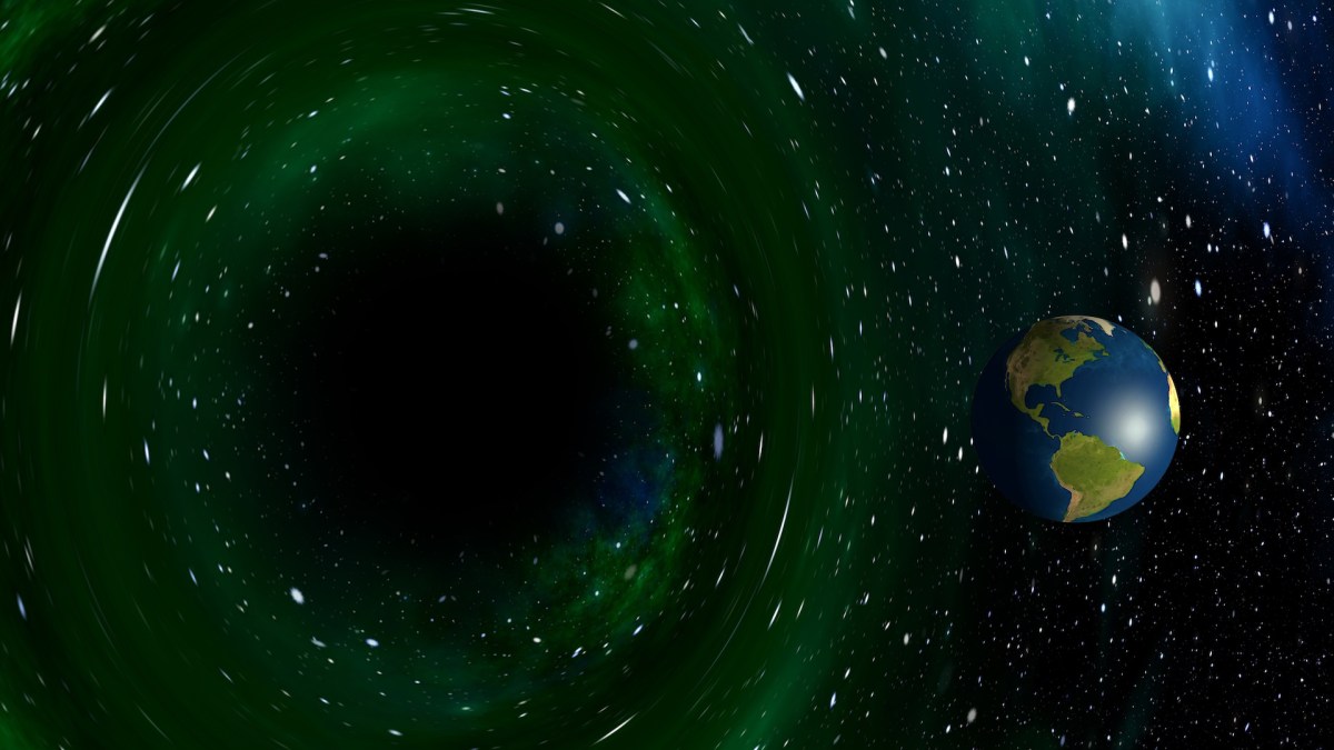 L'image improbable de la Terre prête à être avalée par un trou noir. // Source : Pixabay (photo recadrée) L'image improbable de la Terre prête à être avalée par un trou noir. // Source : Pixabay (photo recadrée)