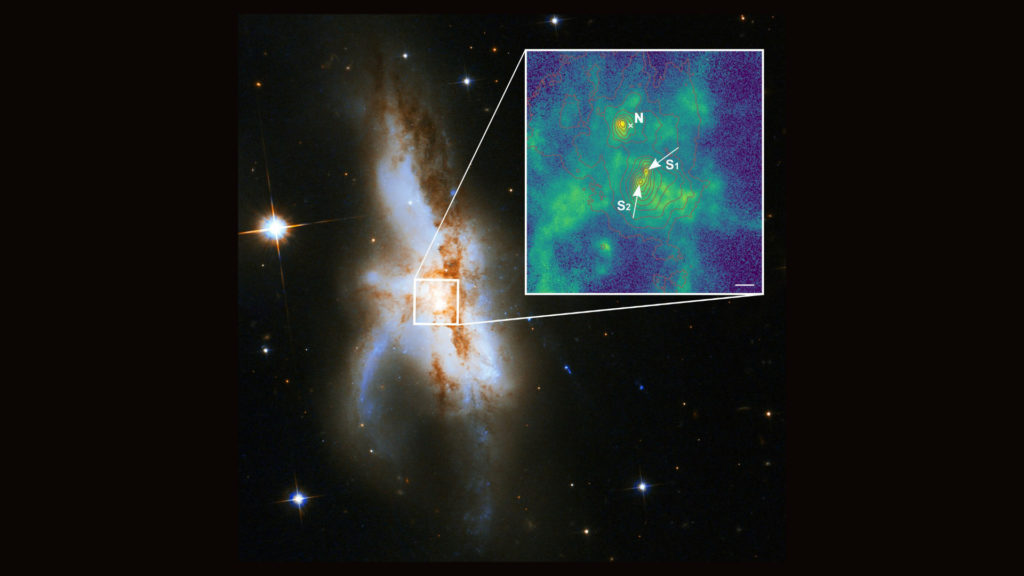 Les trois trous noirs au centre de la galaxie NGC 6240. // Source : P Weilbacher (AIP), NASA, ESA, the Hubble Heritage (STScI/AURA)-ESA/Hubble Collaboration, and A Evans (University of Virginia, Charlottesville/NRAO/Stony Brook University) (photo recadrée) Les trois trous noirs au centre de la galaxie NGC 6240. // Source : P Weilbacher (AIP), NASA, ESA, the Hubble Heritage (STScI/AURA)-ESA/Hubble Collaboration, and A Evans (University of Virginia, Charlottesville/NRAO/Stony Brook University) (photo recadrée)