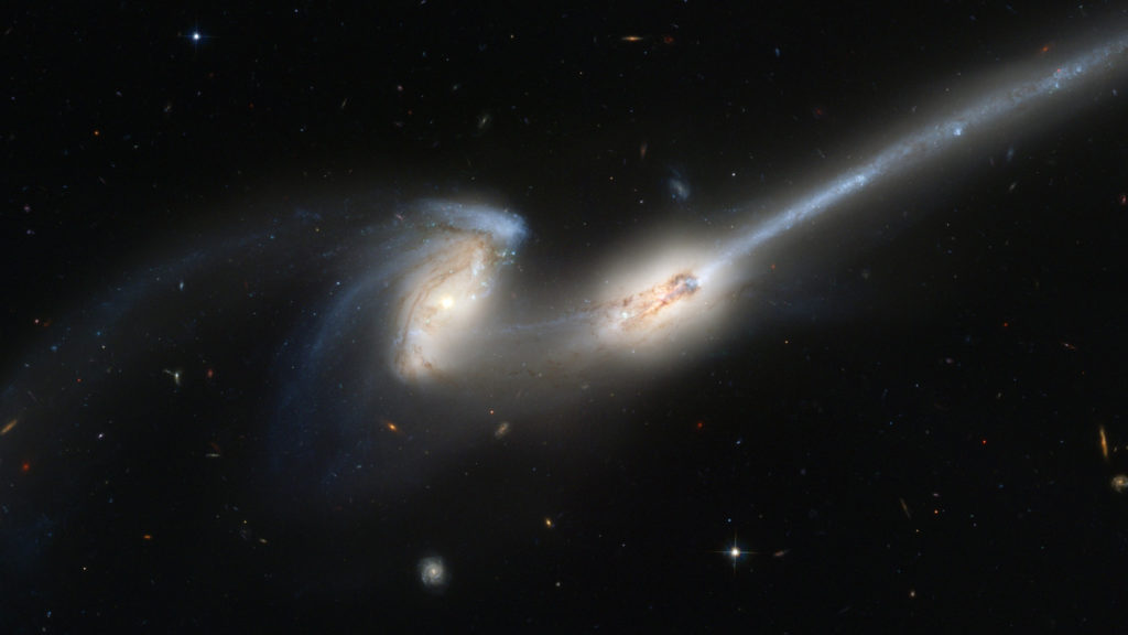 Une fusion entre deux galaxies. // Source : PublicDomainPictures/CC0 Domaine public (photo recadrée) Une fusion entre deux galaxies. // Source : PublicDomainPictures/CC0 Domaine public (photo recadrée)