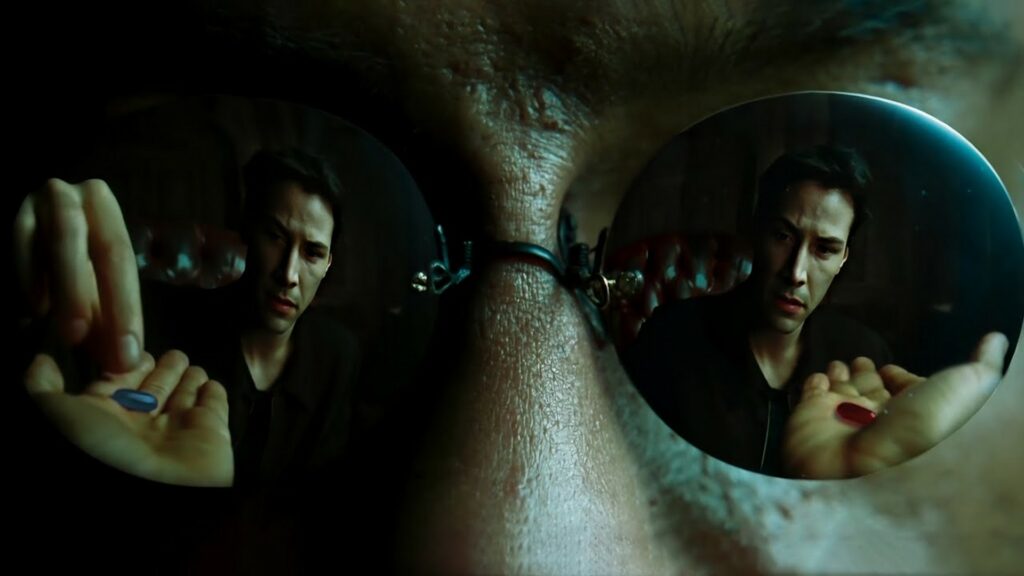 Dans Matrix, Neo prend la pilule rouge pour sortir de la matrice et commencer sa quête initiatique d'élu. // Source : The Matrix, film (1999) Dans Matrix, Neo prend la pilule rouge pour sortir de la matrice et commencer sa quête initiatique d'élu. // Source : The Matrix, film (1999)