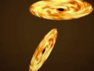 Deux trous noirs. // Source : Capture d'écran YouTube What If Deux trous noirs. // Source : Capture d'écran YouTube What If