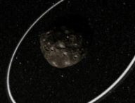 Vue d'artiste du centaure (10199) Chariclo. // Source : ESO/L. Calçada/M. Kornmesser/Nick Risinger (skysurvey.org) (image recadrée)