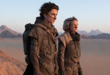 Paul et dame Jessica portant le distille dans le désert d'Arrakis. // Source : Warner Paul et dame Jessica portant le distille dans le désert d'Arrakis. // Source : Warner