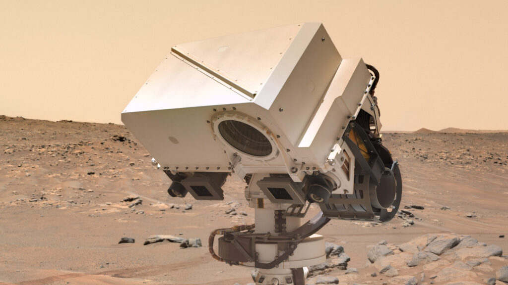 Perseverance observant une roche sur Mars. // Source : NASA/JPL-Caltech/Thomas Appéré (photo recadrée) Perseverance observant une roche sur Mars. // Source : NASA/JPL-Caltech/Thomas Appéré (photo recadrée)