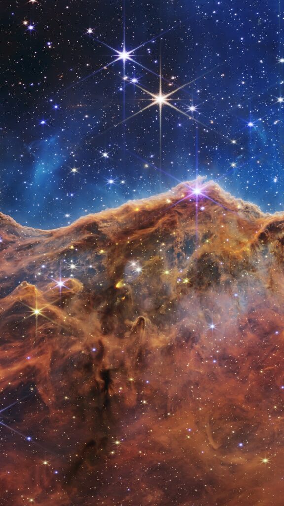 Un morceau de la nébuleuse de la Carène // Source : Nasa // Montage de Sophie Aubé pour Numerama Un morceau de la nébuleuse de la Carène // Source : Nasa // Montage de Sophie Aubé pour Numerama