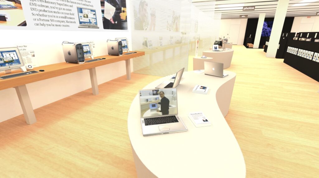 Dans l'Apple Store de Tysons Corner, un PowerBook à l'entrée diffuse la vidéo de la visite guidée par Steve Jobs. // Source : Capture Numerama Dans l'Apple Store de Tysons Corner, un PowerBook à l'entrée diffuse la vidéo de la visite guidée par Steve Jobs. // Source : Capture Numerama