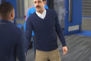 Ted Lasso accueille Kylian Mbappé dans FIFA 23, en compagnie de Jamie Tartt. // Source : Numerama Ted Lasso accueille Kylian Mbappé dans FIFA 23, en compagnie de Jamie Tartt. // Source : Numerama