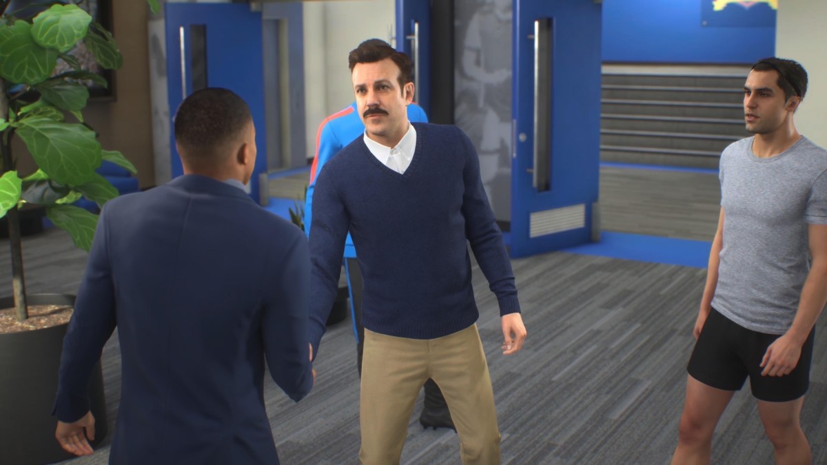 Ted Lasso accueille Kylian Mbappé dans FIFA 23, en compagnie de Jamie Tartt. // Source : Numerama Ted Lasso accueille Kylian Mbappé dans FIFA 23, en compagnie de Jamie Tartt. // Source : Numerama