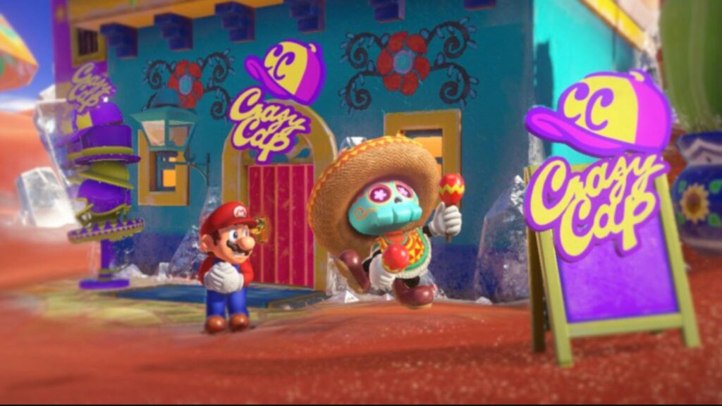 Mario devant une maison bleu mexicaine dans Mario Odyssey // Source : capture d'écran Mario devant une maison bleu mexicaine dans Mario Odyssey // Source : capture d'écran