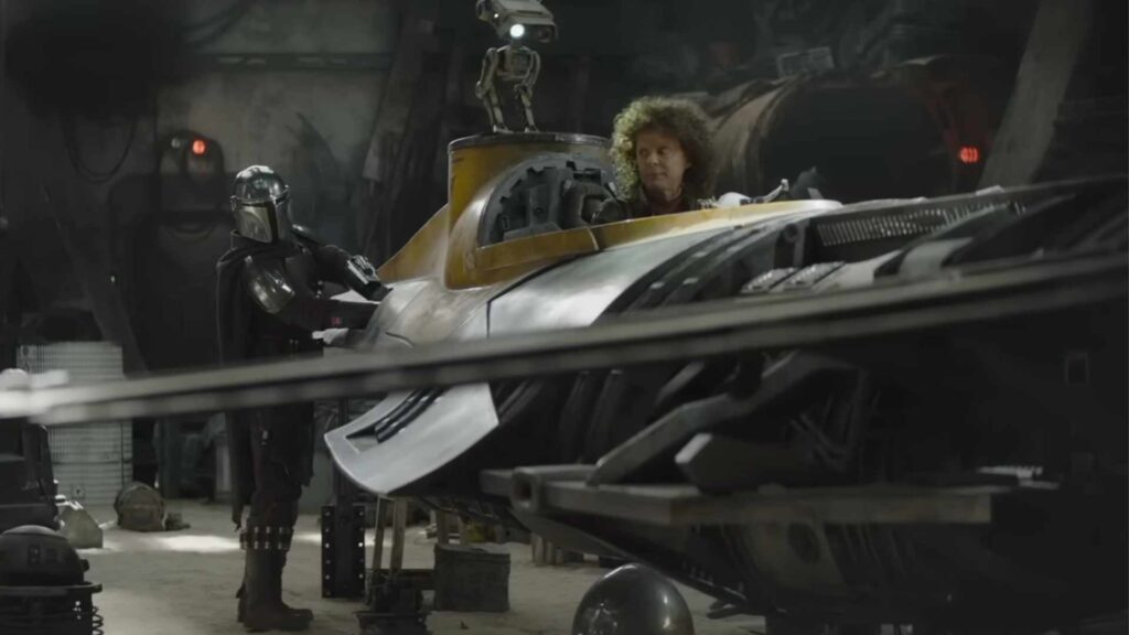 Le Mandalorien et Peli Motto réparent ensemble le vaisseau dans Le Livre de Boba Fett // Source : YouTube / Ashkhan Le Mandalorien et Peli Motto réparent ensemble le vaisseau dans Le Livre de Boba Fett // Source : YouTube / Ashkhan
