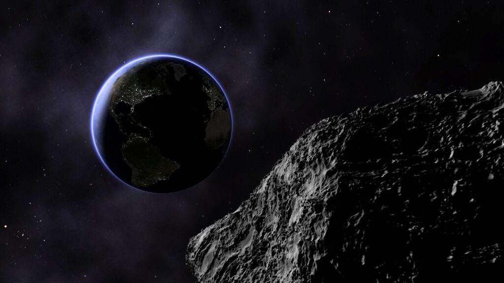 Un astéroïde et la Terre. // Source : Canva Un astéroïde et la Terre. // Source : Canva