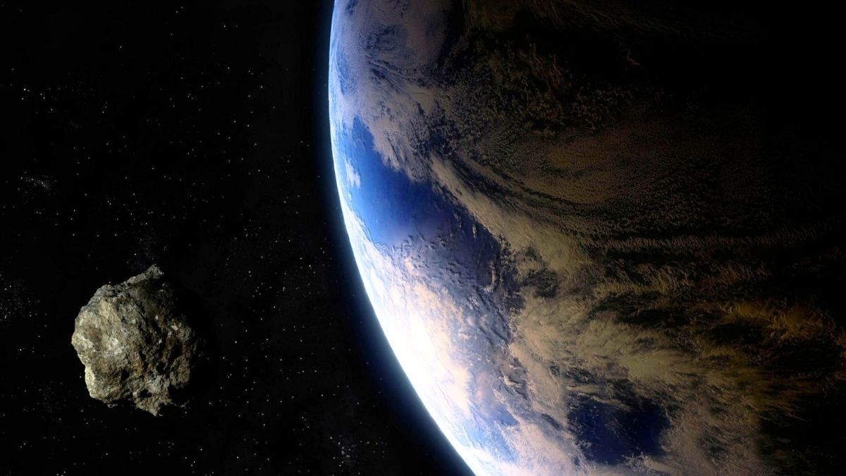 Un astéroïde et la Terre. // Source : Canva Un astéroïde et la Terre. // Source : Canva