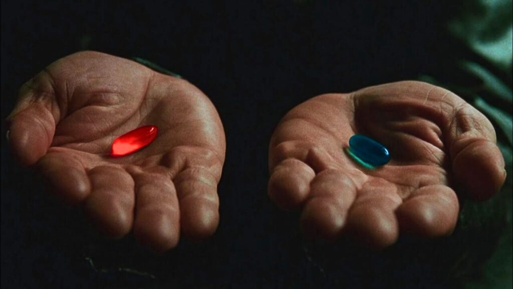 Pilule rouge ou pilule bleue ? C'est une scène culte de Matrix. // Source : Warner Pilule rouge ou pilule bleue ? C'est une scène culte de Matrix. // Source : Warner