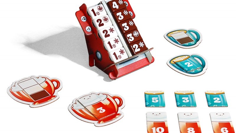 La machine à espresso avec ses gros jetons de lait et de café. // Source : Schmidt Spiele
