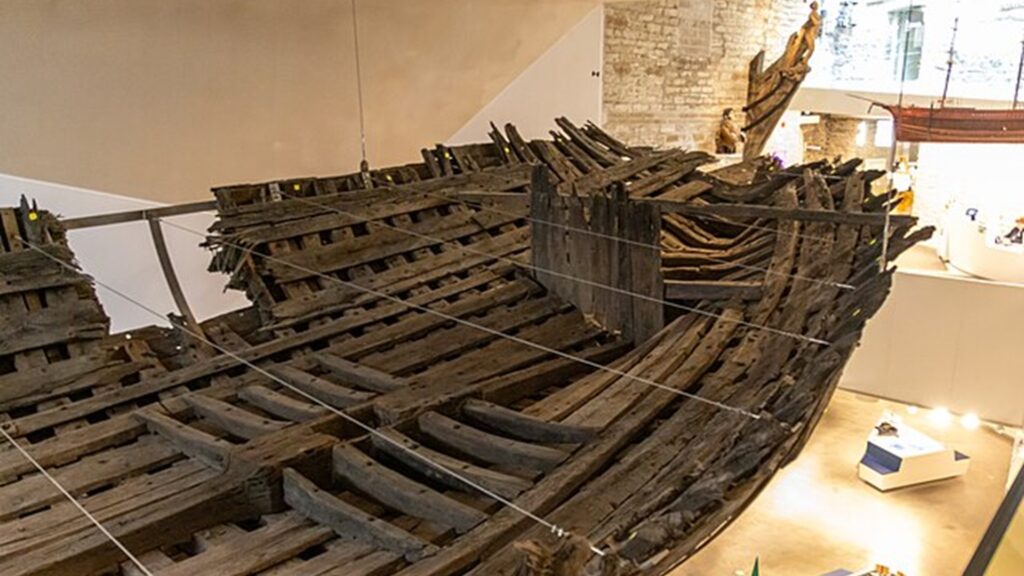 Cog - wreck of a medieval merchant ship. Built and sank around 14th century, discovered during construction work in 2015 Cog - wreck of a medieval merchant ship. Built and sank around 14th century, discovered during construction work in 2015