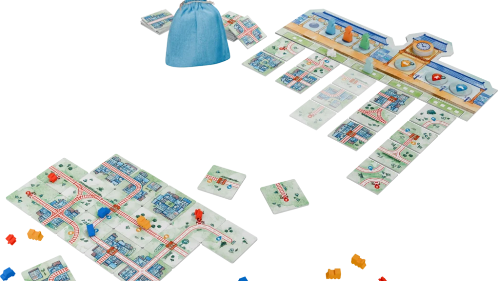 Une partie en cours, avec une ville en bas et les lots de tuiles en haut. // Source : Iello Une partie en cours, avec une ville en bas et les lots de tuiles en haut. // Source : Iello