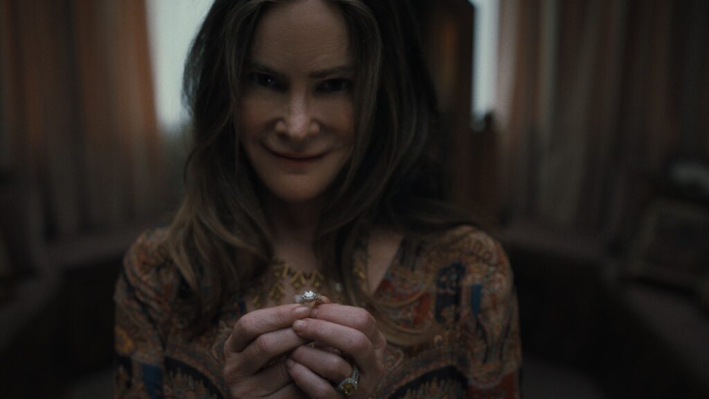 Something Very Bad Is Going to Happen. Jennifer Jason Leigh as Victoria in episode 102 of Something Very Bad Is Going to Happen. Cr. Courtesy of Netflix © 2026 Something Very Bad Is Going to Happen. Jennifer Jason Leigh as Victoria in episode 102 of Something Very Bad Is Going to Happen. Cr. Courtesy of Netflix © 2026