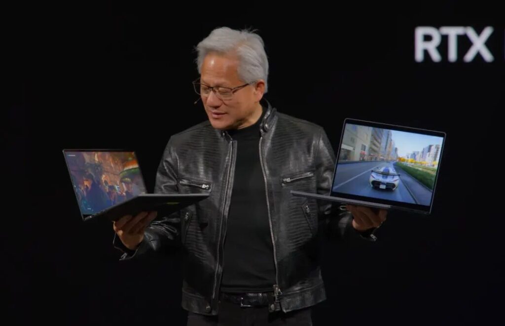 Jensen Huang avec les premiers PC RTX Spark. Jensen Huang avec les premiers PC RTX Spark.