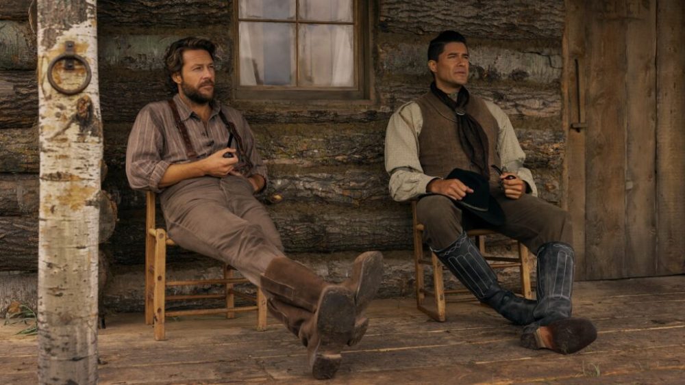 Little House on the Prairie. (L to R) Luke Bracey as Charles Ingalls, Meegwun Fairbrother as Mitchell in episode 108 of Little House on the Prairie. Cr. Eric Zachanowich/Netflix © 2026